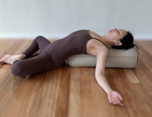 Yin Yoga pose Supported Reclined Butterfly 